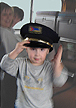 Garrrett with a conductor's hat, a boy I met  on the way out to Los Angeles