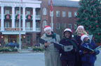 Carolers outside of Garvery Hall sining for the security people at the college after caroling for various nursing homes.