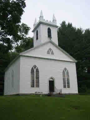 The white clapoard building that houses Saint Paul's Episcopal Church of Otis, MA